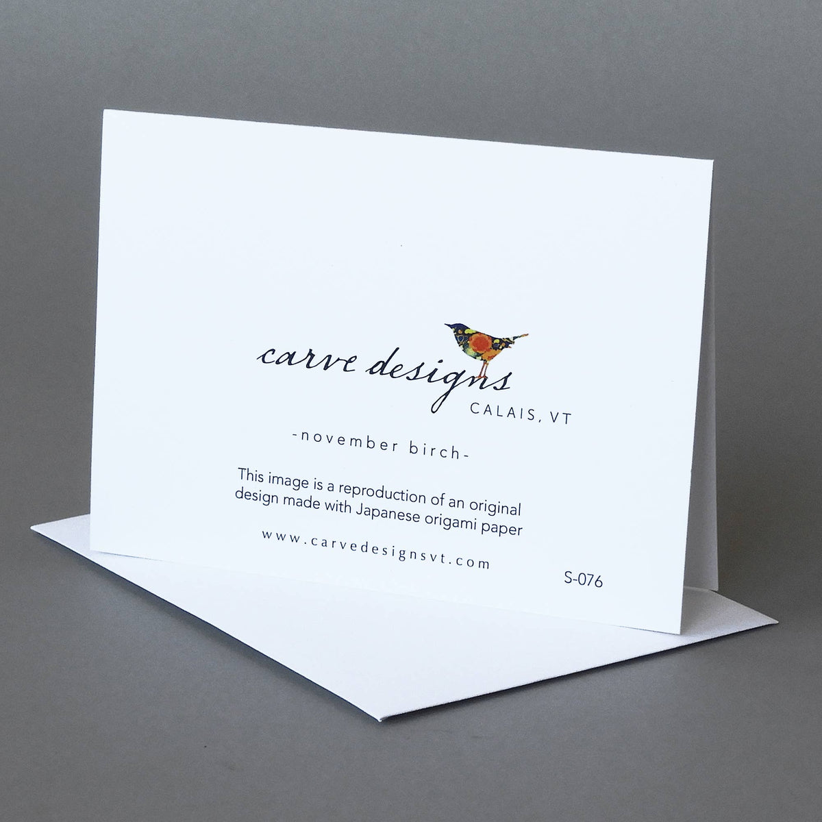 Back of the November Birch notecard with the Carve Designs bird logo, Calais VT, and origami paper reproduction note