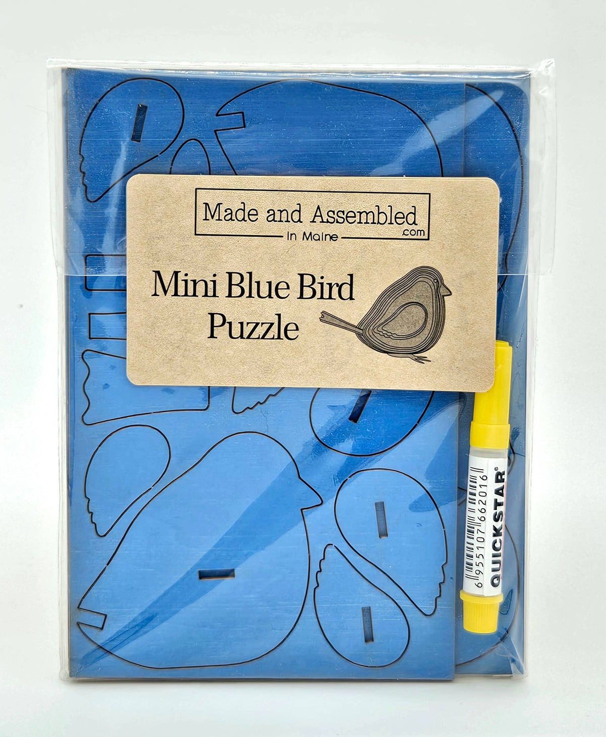 Mini Blue Bird Puzzle in a clear bag with a kraft label and yellow glue pen, blue wood pieces still in the sheet