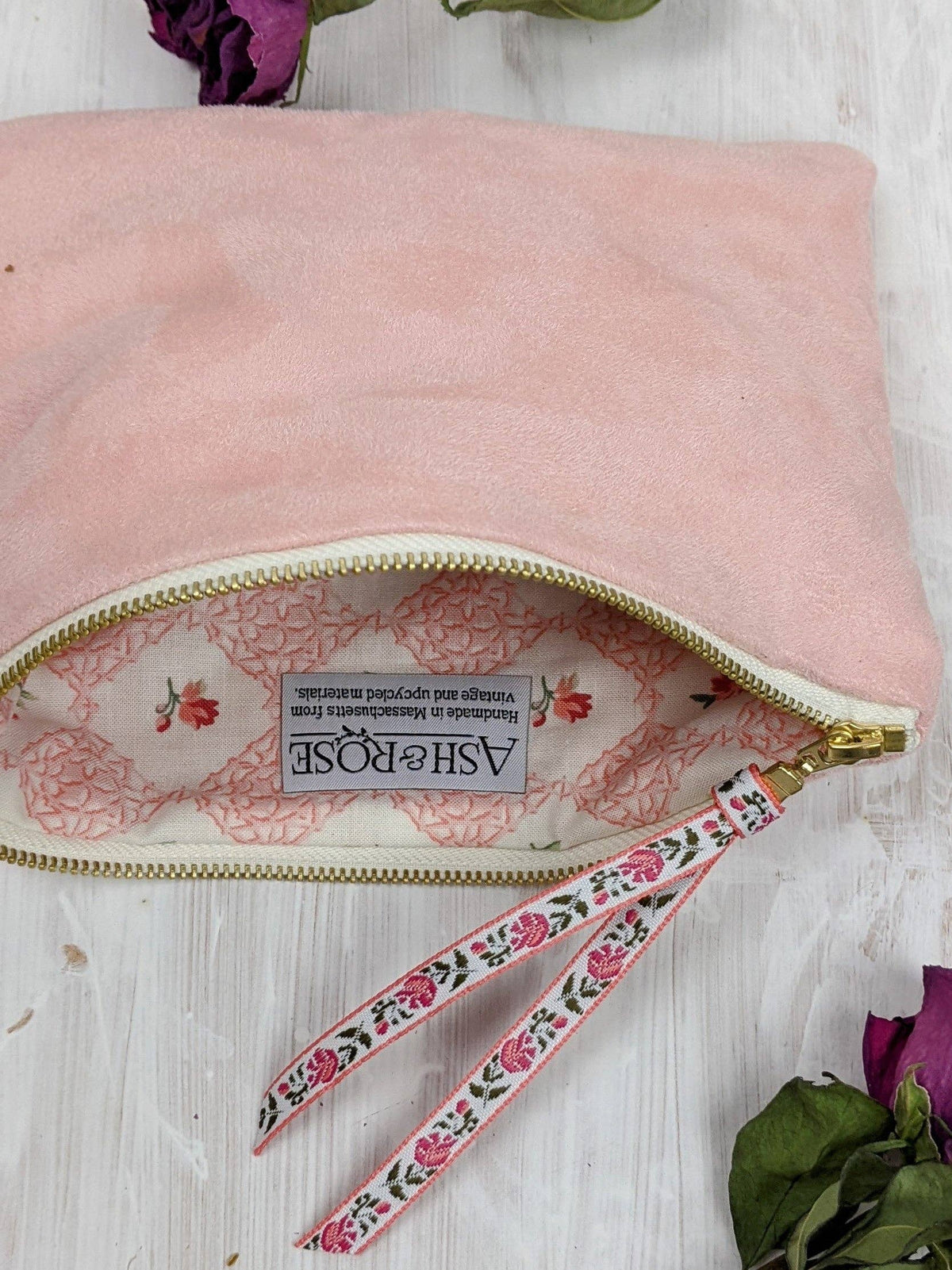 Open Pink Fleur clutch purse showing the floral lining and Ash & Rose label, handmade in Massachusetts from vintage and upcycled materials