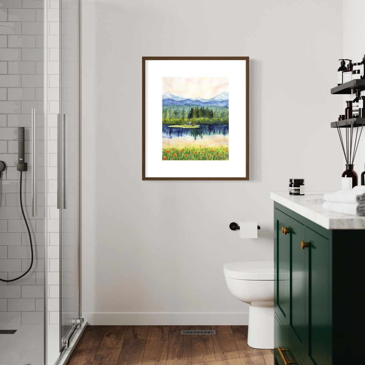 Framed Summer Wanderlust Art Print in a dark wood frame hanging in a bathroom above a toilet and green vanity