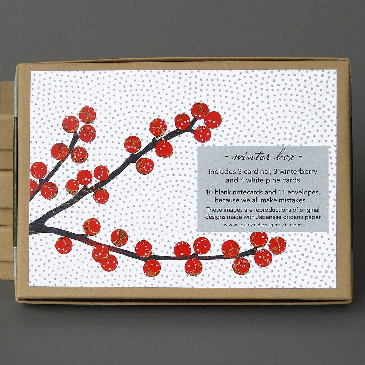 Winter Box lid with a winterberry branch design and a label listing 3 cardinal, 3 winterberry and 4 white pine cards