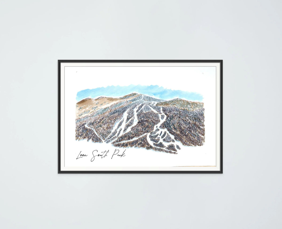 Loon South Peak print in a black frame, hung on a plain wall