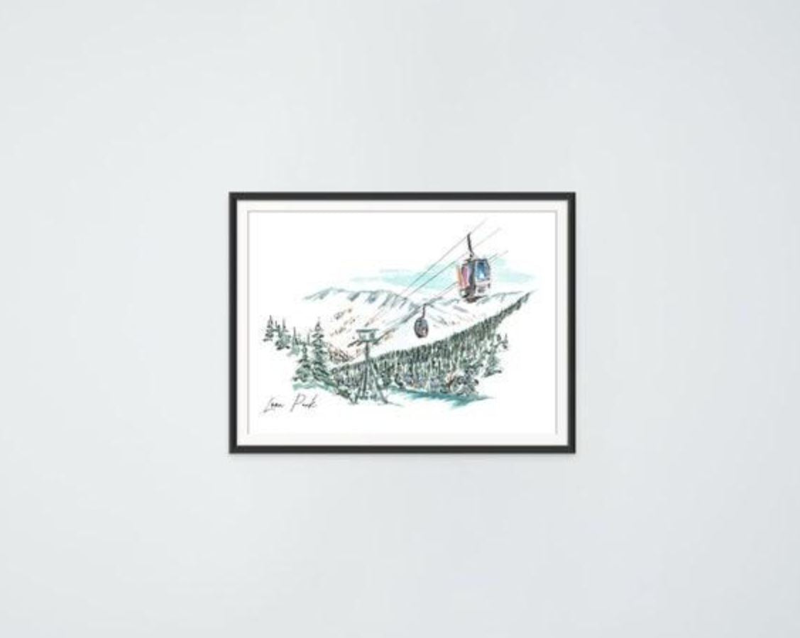 Loon Peak art print in a black frame, hung on a plain wall